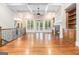 Spacious living room with hardwood floors, coffered ceilings, a stone fireplace and large windows at 115 Edgewood Pkwy, Fayetteville, GA 30215