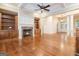 Spacious living room features hardwood floors, fireplace, and built-in bookcases at 115 Edgewood Pkwy, Fayetteville, GA 30215