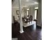Elegant dining room featuring a large wooden table, chandelier lighting, and french doors for a sophisticated ambiance at 119 Glen Eagle Way, Mcdonough, GA 30253