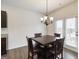 Cozy dining area with modern chandelier and access to the outdoor area at 5396 Pennington Ct, South Fulton, GA 30349