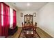 Elegant dining area featuring a china cabinet and a large wooden table at 5396 Pennington Ct, South Fulton, GA 30349