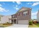 Well-maintained two-story brick home with a two-car garage and manicured lawn at 5396 Pennington Ct, South Fulton, GA 30349