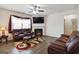 Bright living room with fireplace, stylish decor, and comfortable seating at 5396 Pennington Ct, South Fulton, GA 30349