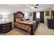 Elegant main bedroom with decorative bed frame, ceiling fan, and carpet flooring at 5396 Pennington Ct, South Fulton, GA 30349