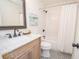 Bright bathroom featuring a shower-tub, patterned tile floor, and a stylish vanity with marble countertop at 185 Chimney Springs, Tyrone, GA 30290