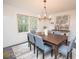 Charming dining room with natural light, a decorative chandelier, and an inviting ambiance at 185 Chimney Springs, Tyrone, GA 30290