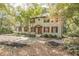 View of the home with new landscaping including black mulch and flowering plants at 185 Chimney Springs, Tyrone, GA 30290