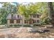 Charming two-story home with well-manicured lawn and mature trees at 185 Chimney Springs, Tyrone, GA 30290