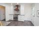 Kitchen featuring stainless steel oven, custom range hood, stylish backsplash, and white cabinets at 185 Chimney Springs, Tyrone, GA 30290
