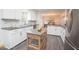 A kitchen with stainless steel appliances, light countertops, and a wood island at 185 Chimney Springs, Tyrone, GA 30290