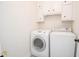 Laundry room featuring a washing machine and dryer with ample storage above at 185 Chimney Springs, Tyrone, GA 30290