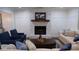 Inviting living room featuring a brick fireplace, comfortable seating, and stylish decor at 185 Chimney Springs, Tyrone, GA 30290