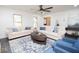 Bright living room featuring hardwood floors, fresh paint and designer furniture at 185 Chimney Springs, Tyrone, GA 30290