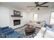 Cozy living room with a white brick fireplace, neutral walls, and comfortable seating at 185 Chimney Springs, Tyrone, GA 30290