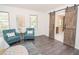 Comfortable main bedroom with an ensuite bathroom, barn door, and natural light flowing through multiple windows at 185 Chimney Springs, Tyrone, GA 30290