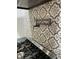 Close-up of a gas range with patterned tile backsplash and pot filler faucet at 185 Chimney Springs, Tyrone, GA 30290