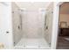 Beautiful bathroom with a glass enclosed shower, double shower heads, and decorative tile floors at 185 Chimney Springs, Tyrone, GA 30290
