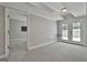 Finished basement with French doors leading outside and an open doorway to another room at 210 Short Rd, Sharpsburg, GA 30277