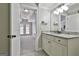 Bathroom featuring a granite countertop, vanity, and doorway views of another room and French doors at 210 Short Rd, Sharpsburg, GA 30277