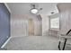 This bedroom has neutral carpet, a window overlooking the backyard, and adjacent bathroom at 210 Short Rd, Sharpsburg, GA 30277