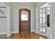 Inviting entryway with a wood door and hardwood floors at 210 Short Rd, Sharpsburg, GA 30277