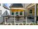 Comfortable back deck with seating, an umbrella, and an outdoor dining area at 10140 Grandview Sq, Duluth, GA 30097