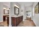 Stylish bathroom showcases a wood vanity with granite counters and modern fixtures at 10140 Grandview Sq, Duluth, GA 30097