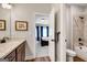 Bright bathroom featuring a vanity with stone countertop and a separate tub and shower at 10140 Grandview Sq, Duluth, GA 30097