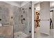 Tile and glass enclosed shower, next to an open doorway to a walk-in closet at 10140 Grandview Sq, Duluth, GA 30097