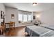 Bright bedroom featuring dual beds, a window seat, a workspace, and charming decorations at 10140 Grandview Sq, Duluth, GA 30097