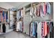 Organized walk-in closet with ample storage, shelving, and hanging space for an efficient wardrobe system at 10140 Grandview Sq, Duluth, GA 30097