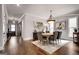 Spacious dining room featuring hardwood floors, large windows, and stylish decor at 10140 Grandview Sq, Duluth, GA 30097