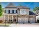 Charming two-story home featuring a stone and siding facade, complemented by a cozy front porch at 10140 Grandview Sq, Duluth, GA 30097