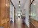 Elegant foyer with hardwood floors, beautiful lighting, and inviting open access to the rest of the home at 10140 Grandview Sq, Duluth, GA 30097