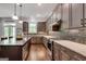 Gourmet kitchen features stainless steel appliances, granite countertops, and a gas cooktop at 10140 Grandview Sq, Duluth, GA 30097
