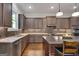 Kitchen with a sink area with granite countertops, stainless steel appliances, and tiled backsplash at 10140 Grandview Sq, Duluth, GA 30097