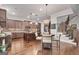 Spacious kitchen features stainless steel appliances, a large island, and custom cabinets at 10140 Grandview Sq, Duluth, GA 30097