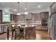 This kitchen boasts custom cabinetry, stainless appliances, granite countertops, and hardwood floors at 10140 Grandview Sq, Duluth, GA 30097