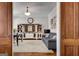 Open living room featuring a large cabinet, hardwood floors, and a comfortable seating arrangement at 10140 Grandview Sq, Duluth, GA 30097