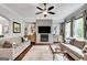 Spacious living room with stone fireplace and access to an abundance of natural light at 10140 Grandview Sq, Duluth, GA 30097