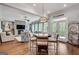 Open-concept living room features a stone fireplace, hardwood floors, and a cozy seating area at 10140 Grandview Sq, Duluth, GA 30097