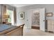 Bright main bedroom with a large window and light neutral walls and carpet at 10140 Grandview Sq, Duluth, GA 30097