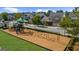 Community playground featuring swings and slides within a residential neighborhood at 10140 Grandview Sq, Duluth, GA 30097