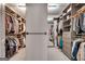 Organized walk-in closet with extensive shelving and hanging storage solutions at 10140 Grandview Sq, Duluth, GA 30097