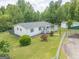 This aerial view shows the home with its well-maintained lawn and landscaping at 40 N Villa Rd, Villa Rica, GA 30180