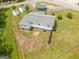 Aerial view of a charming home featuring a well-maintained yard, detached garages and a welcoming atmosphere at 40 N Villa Rd, Villa Rica, GA 30180