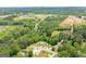 Beautiful aerial view of a home nestled in a lush green landscape with nearby construction and community buildings at 40 N Villa Rd, Villa Rica, GA 30180
