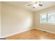 Bright bedroom with hardwood floors, a ceiling fan, neutral walls and plenty of natural light from the window at 40 N Villa Rd, Villa Rica, GA 30180