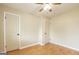 Bright bedroom with hardwood floors and a ceiling fan at 40 N Villa Rd, Villa Rica, GA 30180