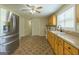 Bright kitchen featuring wood cabinets, modern appliances, and a patterned floor offering ample counter space at 40 N Villa Rd, Villa Rica, GA 30180